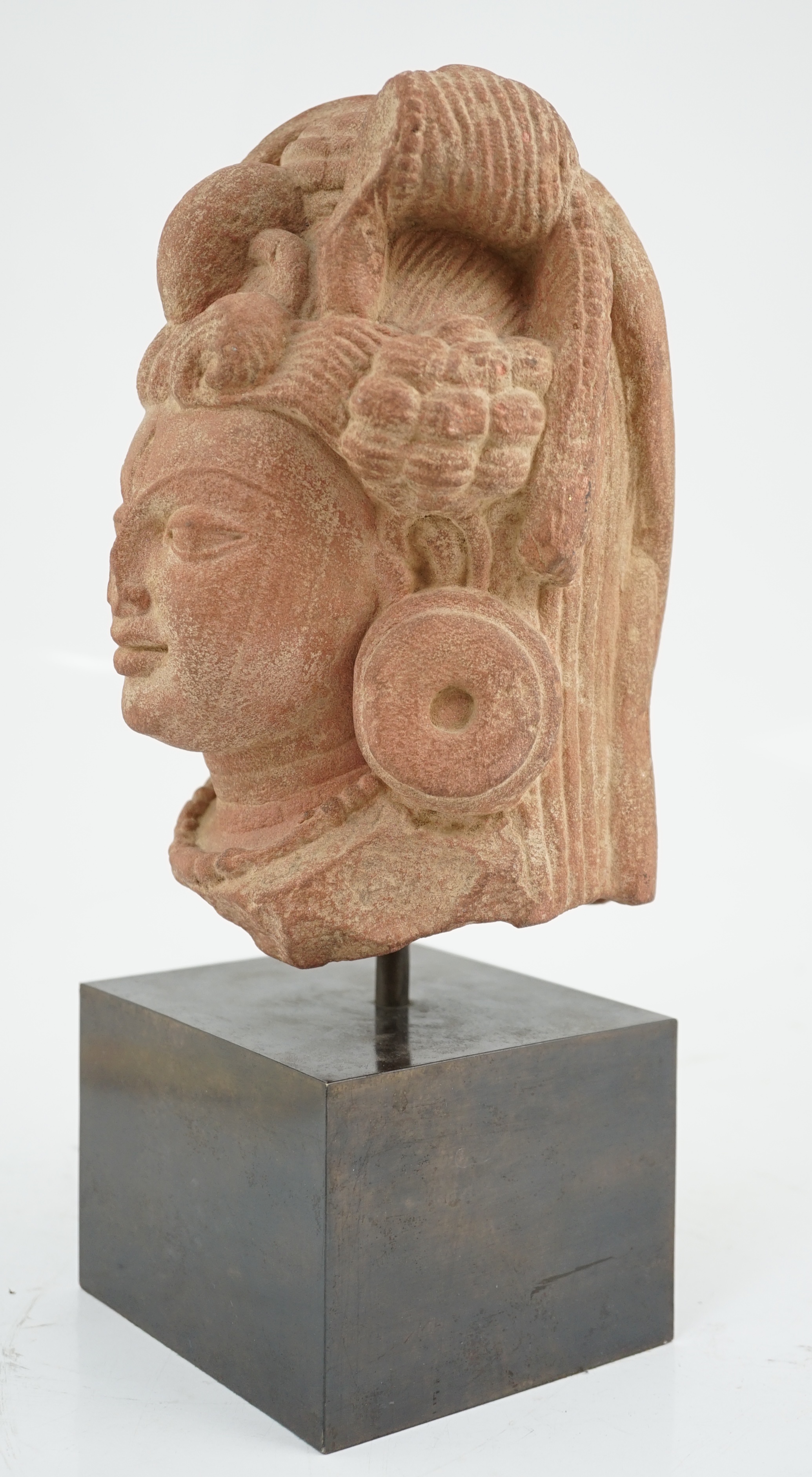 A red stone head of Ardhanarishvara, Muthura region, India, Gupta period, c.5th century A.D.